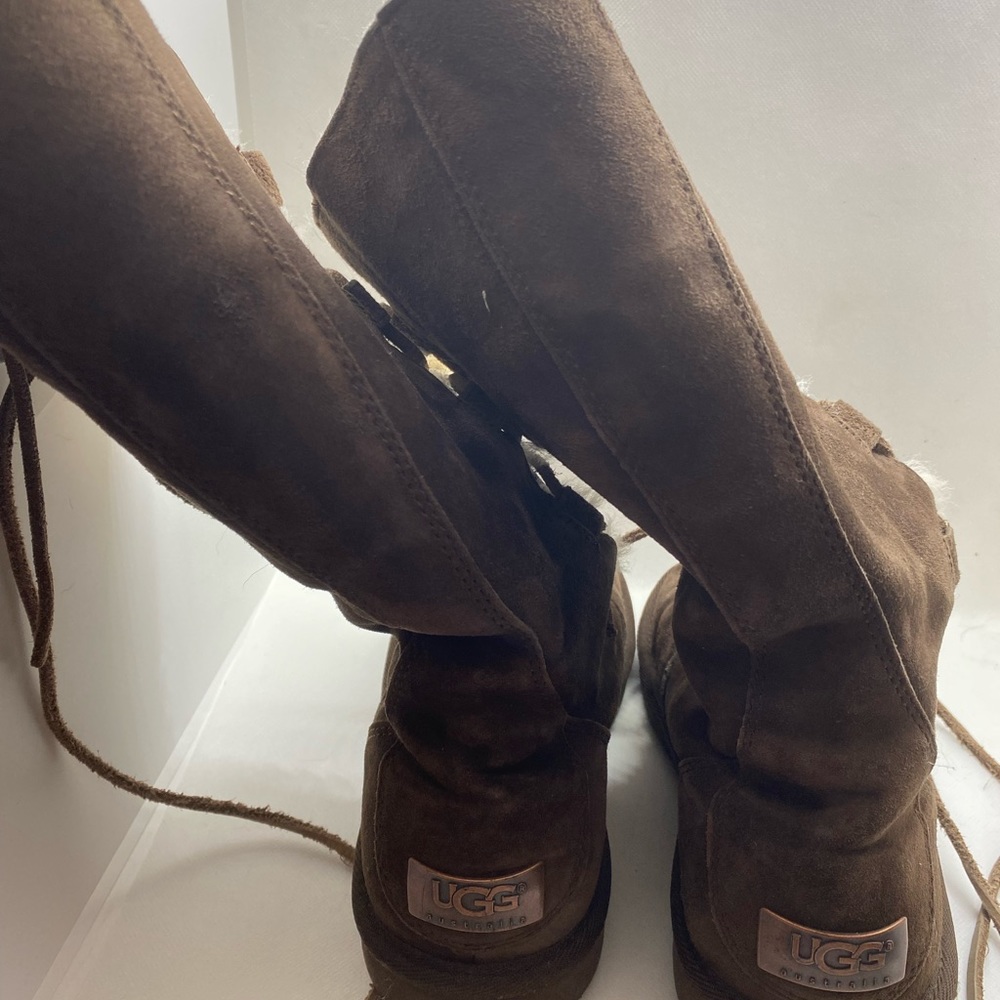 New without box size 7 Ugg lace up boots.